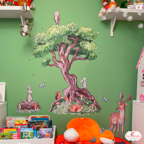Woodland room wall stickers on a green wall, with watercolour animal decals